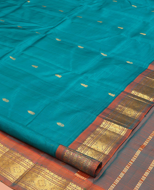 Blue Kanchipuram Silk Saree, Adorned with Zari Buttas, a Contrast One-Sided Zari Border, Zari Striped Pallu, and No Blouse