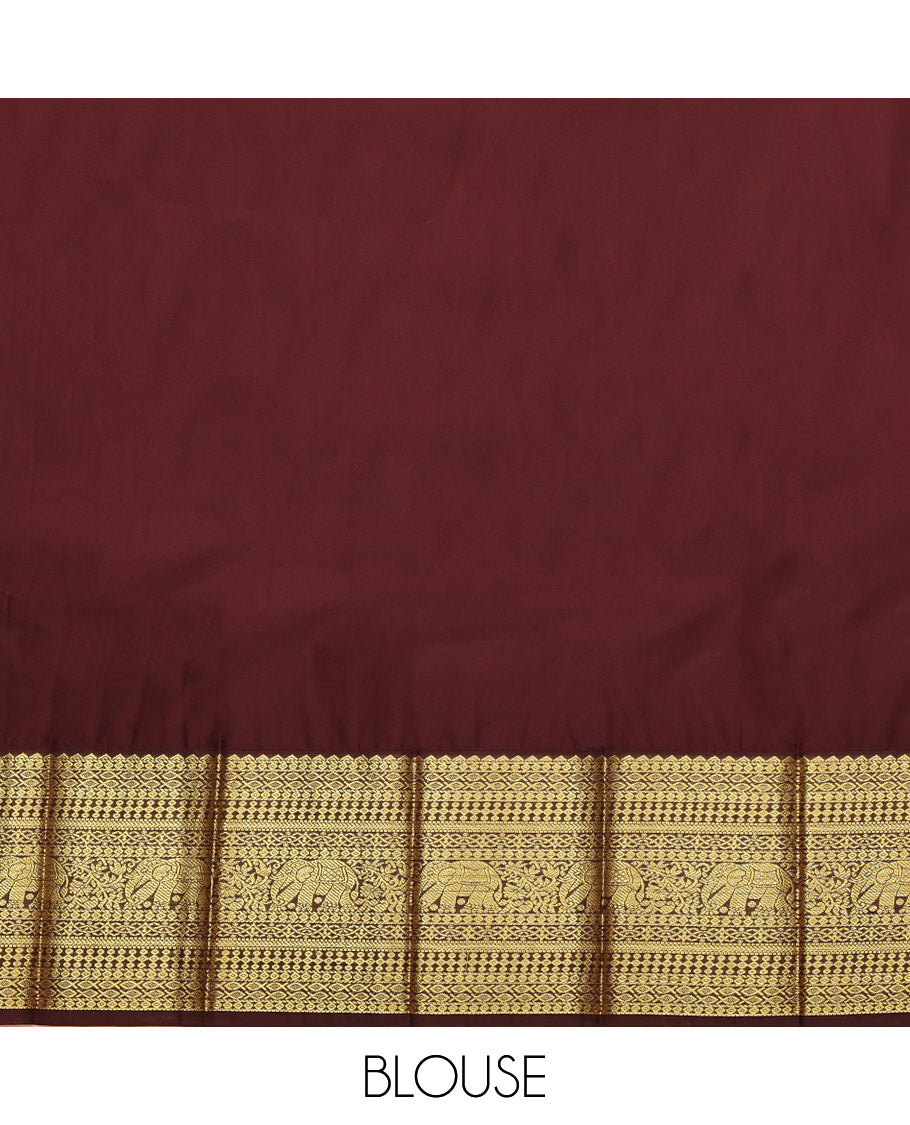 Green Budget Silk Saree, Adorned with Kolam Buttas, Complemented by a Contrast Traditional Zari Border, Grand Pallu, and a Contrast Blouse