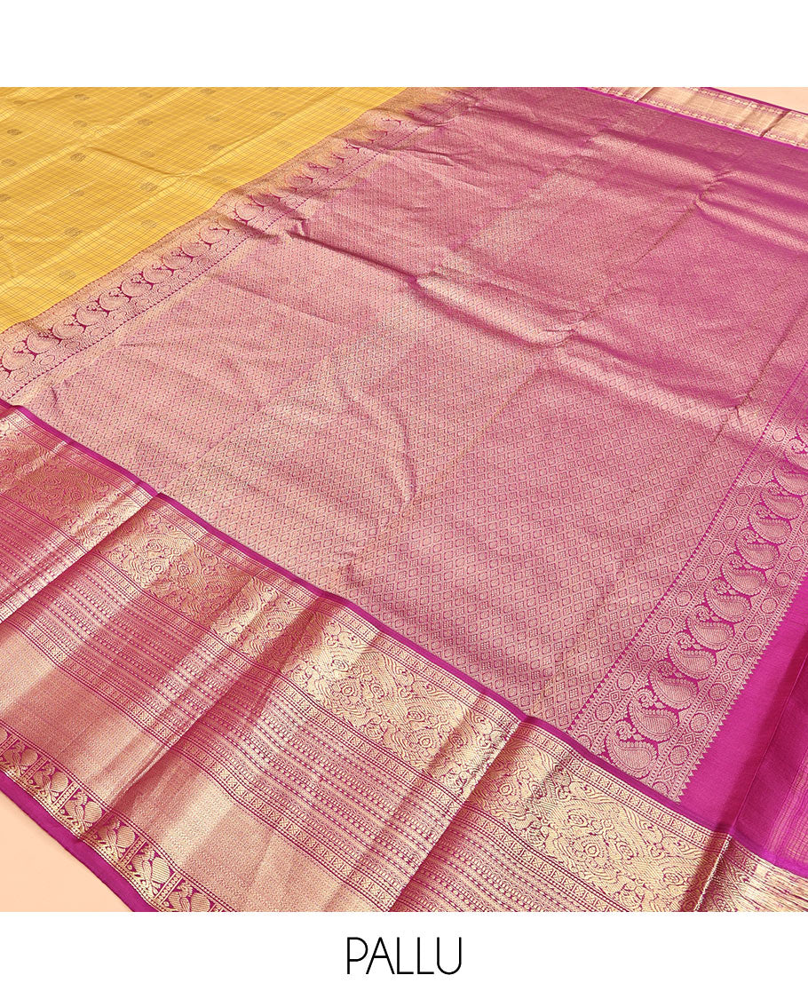 Yellow Vasundhara Silk Saree, Sparsely Sparkled with Zari Buttas and Checks, Complemented by a Contrast Border of Lavangam, Muthu, Kathir, Neli, and Mayil, Jaal Pallu, and a Contrast Blouse