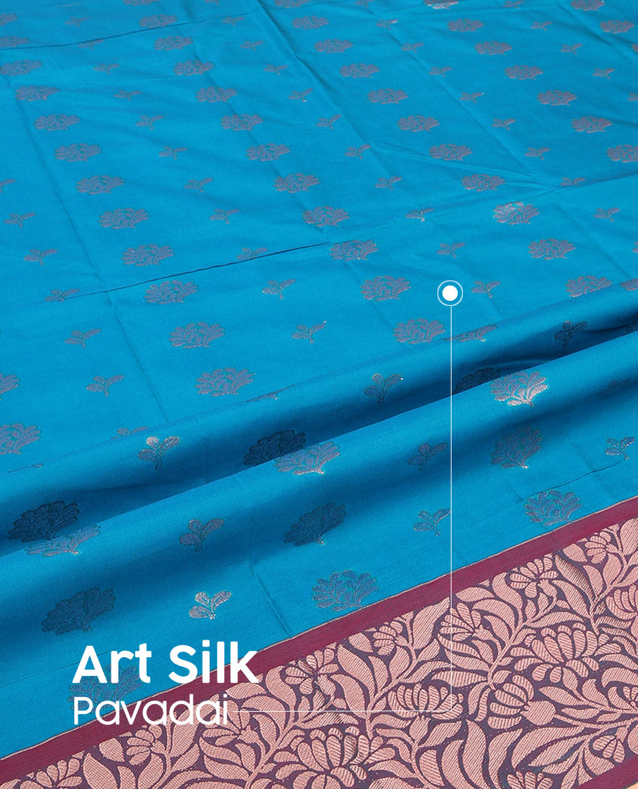 Blue Art Silk Pavadai Material Set, Woven with Floral Zari Buttas All Over Its Skirt, Highlighted with a Contrast Floral Jaal Zari Design Border, and Paired with a Contrast Blouse