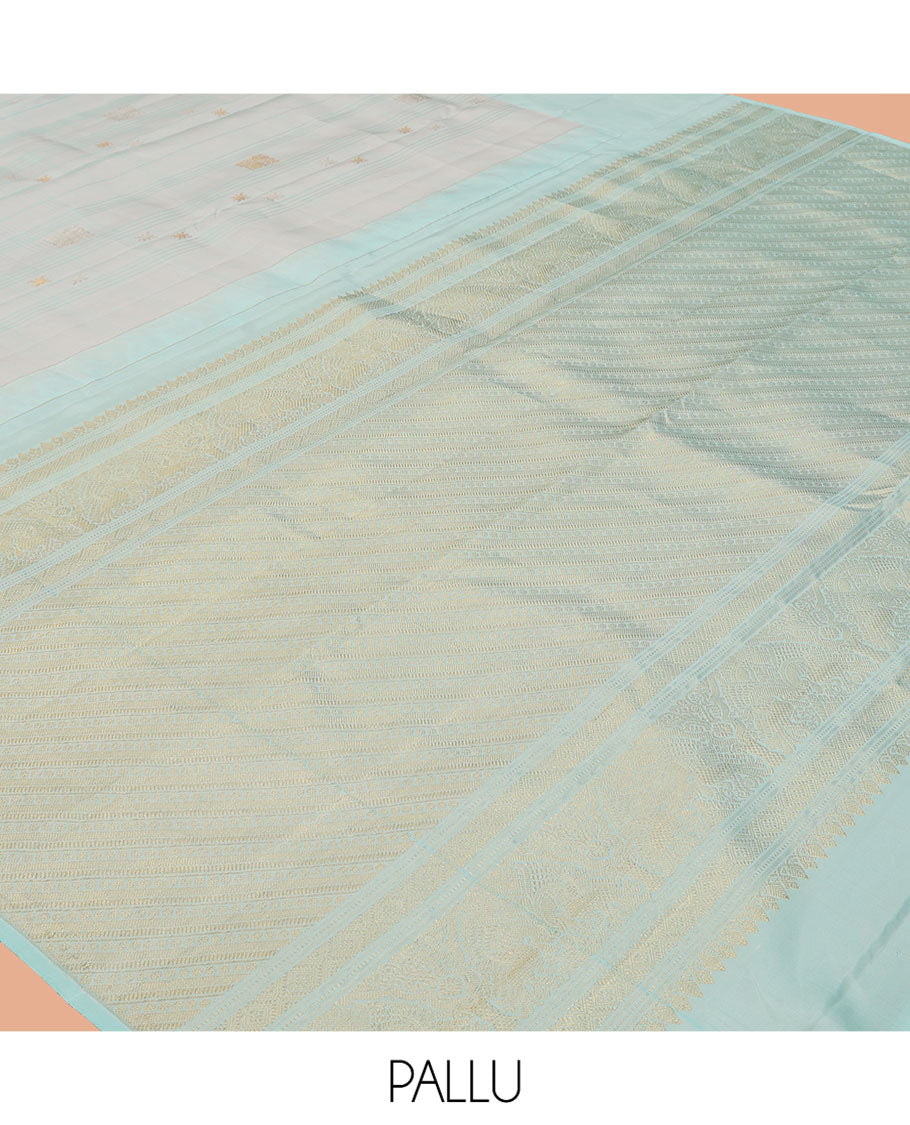 Pale Blue Kanchipuram Silk Saree, Subtly Sparkled with Buttas, and Stripes, a Contrast Border, Zari Design Pallu, and a Matching Blouse