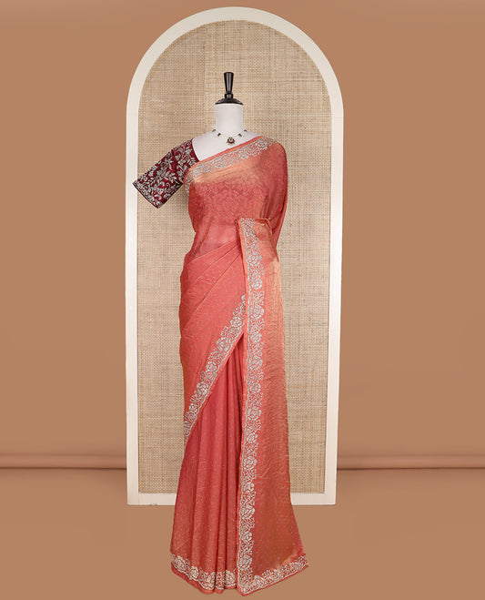 Peach stone work designer saree, micro-stone work border, and a contrast half-sleeve blouse of floral vine design in micro stones