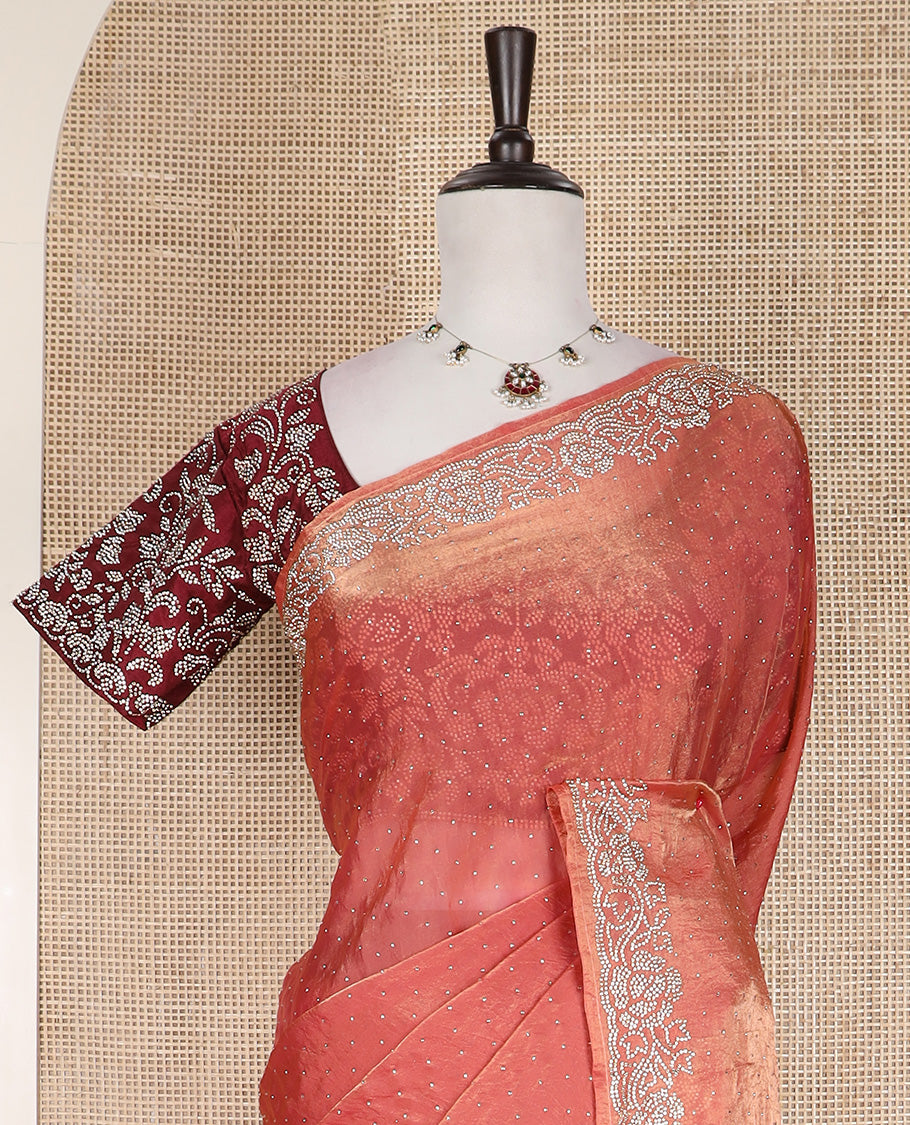 Peach stone work designer saree, micro-stone work border, and a contrast half-sleeve blouse of floral vine design in micro stones