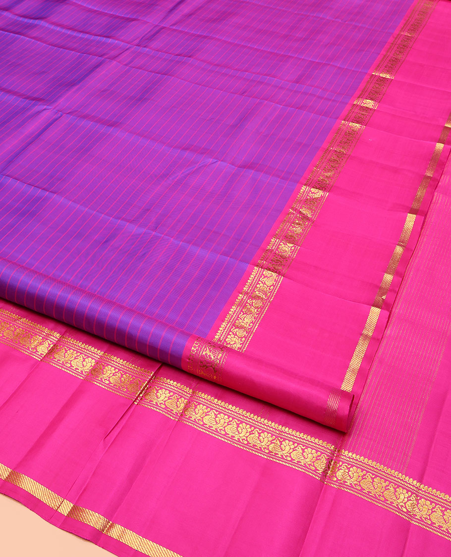 Violet Kanchipuram Silk Saree, Beautified with Stripes on Its Body, Complemented by a Contrast Rettai Pettu Border of Thilakam Mokku, Banaras, Muthu, and Mayil Designs, Subtly Zari Striped Pallu, and Paired with a Contrast Blouse