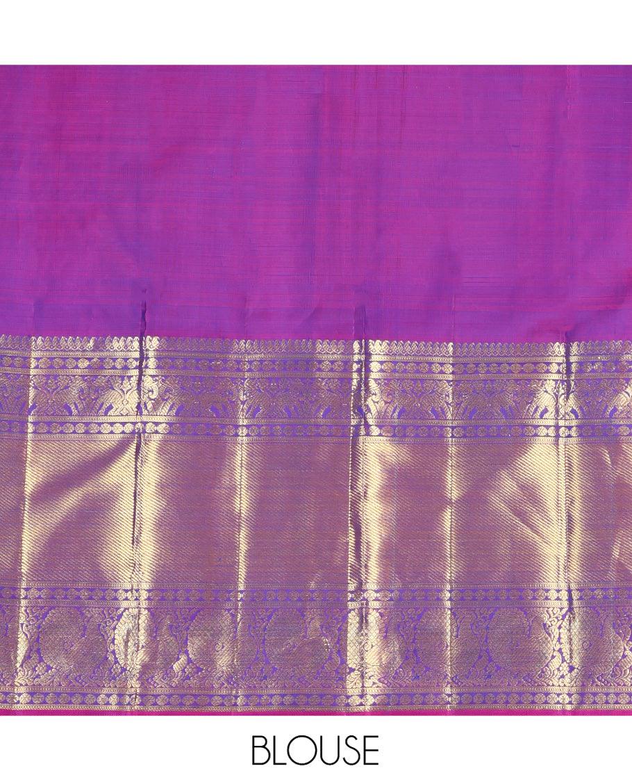 Blue Kanchipuram Silk Saree, Embellished with Zari Buttas All Over Its Body, Complemented by a Contrast Border of Manga Mokku, Poun, Yaali, and Mayil Designs, Pallu of Kodi Visiry Designs, and Paired with a Contrast Blouse