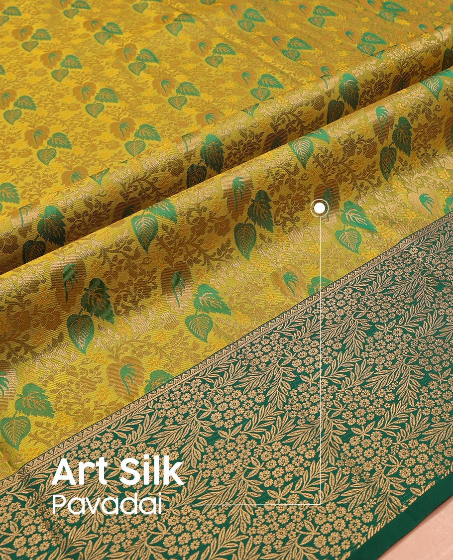 Green Art Silk Pavadai Material Set Mesmerized with Leaf Jacquard Design on Its Skirt, Complemented by a Contrast Floral Zari Design Border, and Paired with a Contrast Blouse