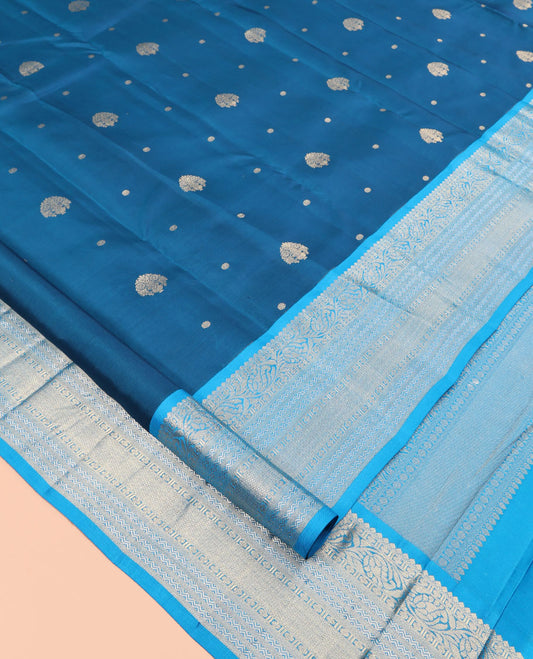 Blue Vasundhara Silk Saree, Decorated with Zari Buttas, Contrast Rettai Pettu Border of Thilakam Mokku, Kodi Visiry, Neli, and Mayil Kann Designs, Grand Pallu, and Contrast Blouse