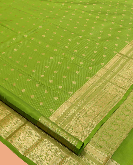 Green Vasundhara Lite Silk Mix Saree, Subtly Sparkled with Zari Buttas and Stripes, a Zari Border of Muthu, Kamalam, and Kodi Visiry, Jaal Pallu, and a Matching Blouse