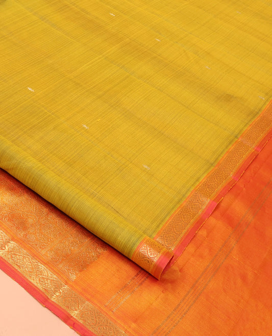 Green Kanchipuram Silk Saree Subtly Sparkled with Zari Buttas, Complemented by a Contrast Border of Jada Nagam Designs, Richly Zari Detailed Pallu, and Paired with a Contrast Blouse