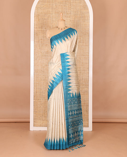 Chikku-rama green plain Khicha katan silk saree, contrast rama green temple border, ikkat printed pallu with tassels, and a contrast blouse