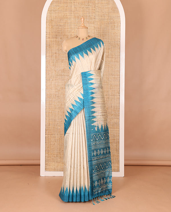 Chikku-rama green plain Khicha katan silk saree, contrast rama green temple border, ikkat printed pallu with tassels, and a contrast blouse