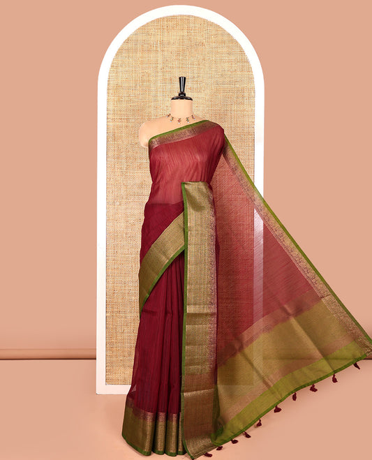 Wine plain linen saree, contrast traditional zari design border, striped pallu, and a contrast embroidered blouse
