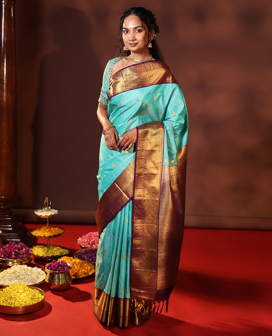 Turquoise Budget Silk Saree Enthralled with Zari Buttas Enclosed Checks, Complemented by a Contrast Traditional Design Border, Vibrant Jaal Design Pallu, and a Contrast Blouse