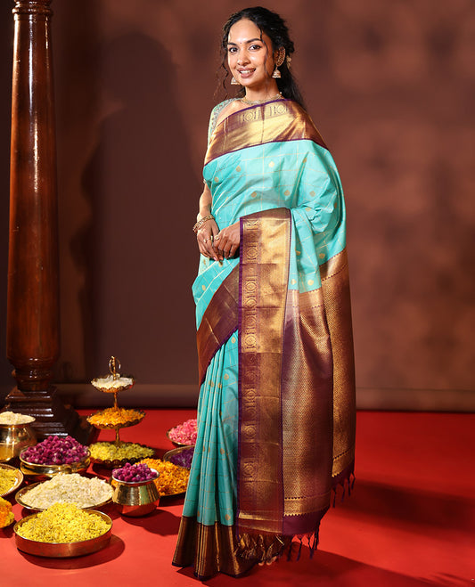 Turquoise Budget Silk Saree Enthralled with Zari Buttas Enclosed Checks, Complemented by a Contrast Traditional Design Border, Vibrant Jaal Design Pallu, and a Contrast Blouse
