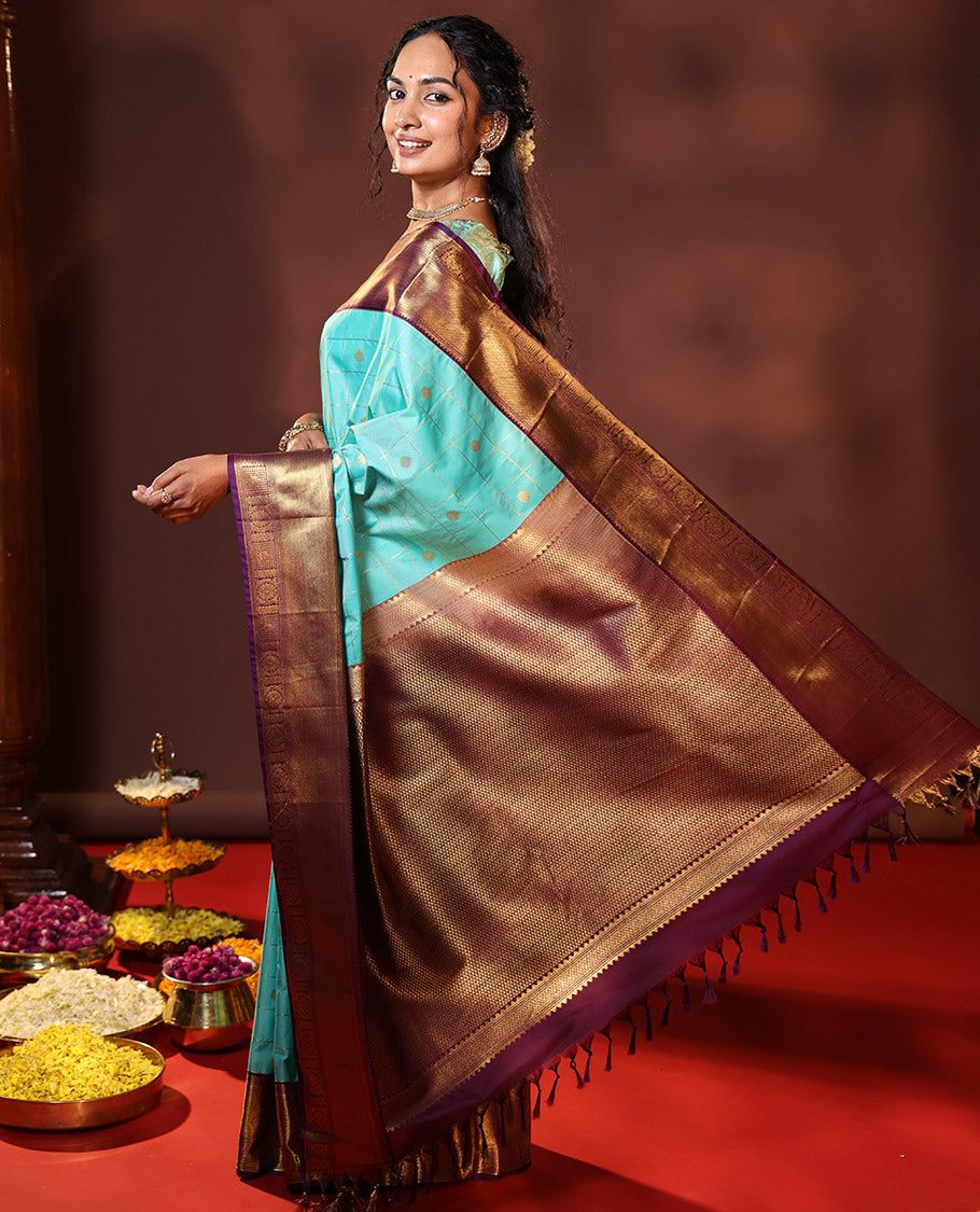 Turquoise Budget Silk Saree Enthralled with Zari Buttas Enclosed Checks, Complemented by a Contrast Traditional Design Border, Vibrant Jaal Design Pallu, and a Contrast Blouse