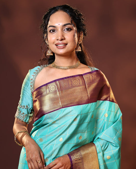Turquoise Budget Silk Saree Enthralled with Zari Buttas Enclosed Checks, Complemented by a Contrast Traditional Design Border, Vibrant Jaal Design Pallu, and a Contrast Blouse