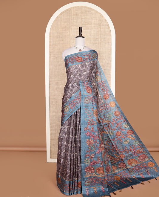Grey intricately printed tussar silk saree, contrast border and and pallu of floral creeper print with embroidery