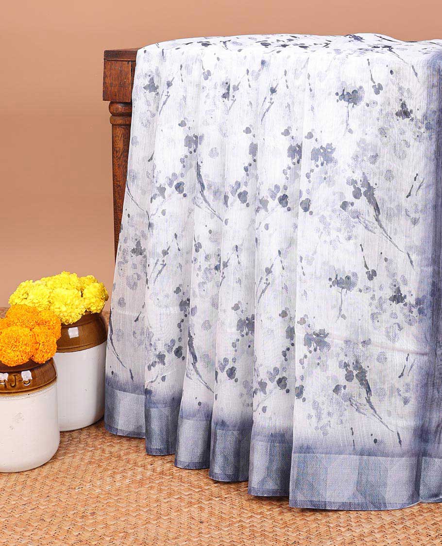 White color with navy blue leaf printed semi-chanderi cotton saree with lining chit pallu along with printed blouse