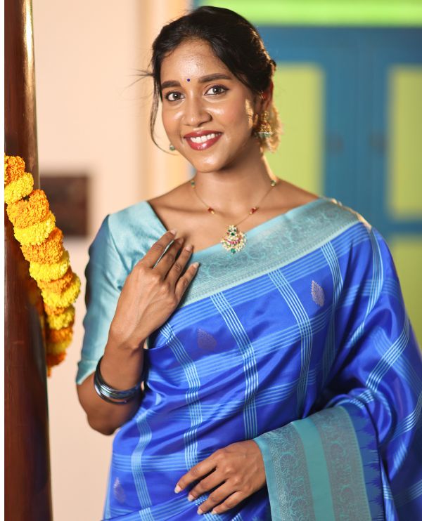 Blue Art Kanchi Silk Saree Features Butta Enclosed Checks, a Contrast Temple Rettai Pettu Border, Grand Pallu, and a Contrast Blouse