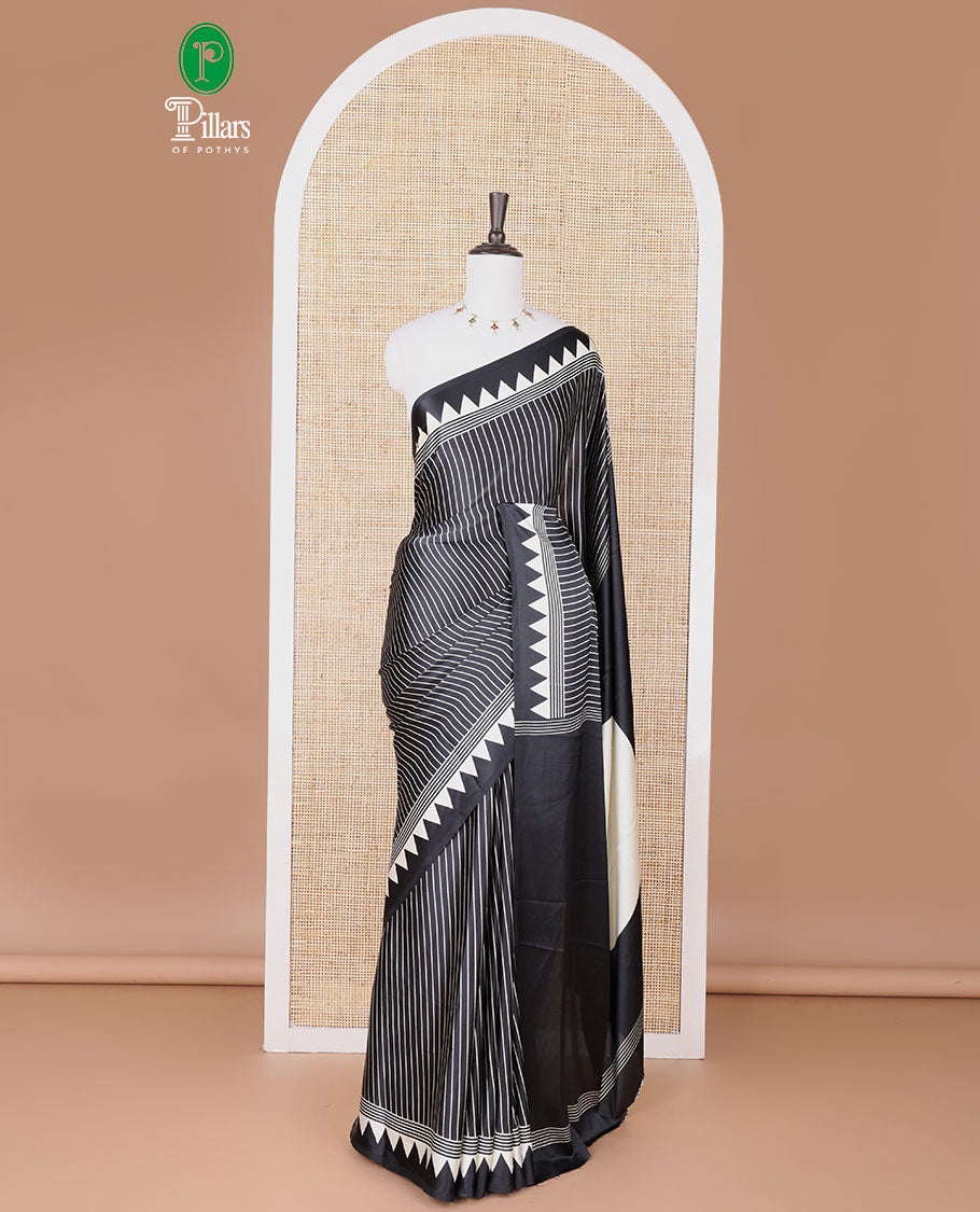 Black with white vertical lining printed design semi modal crepe saree with temple border & circle butta pallu along with printed blouse