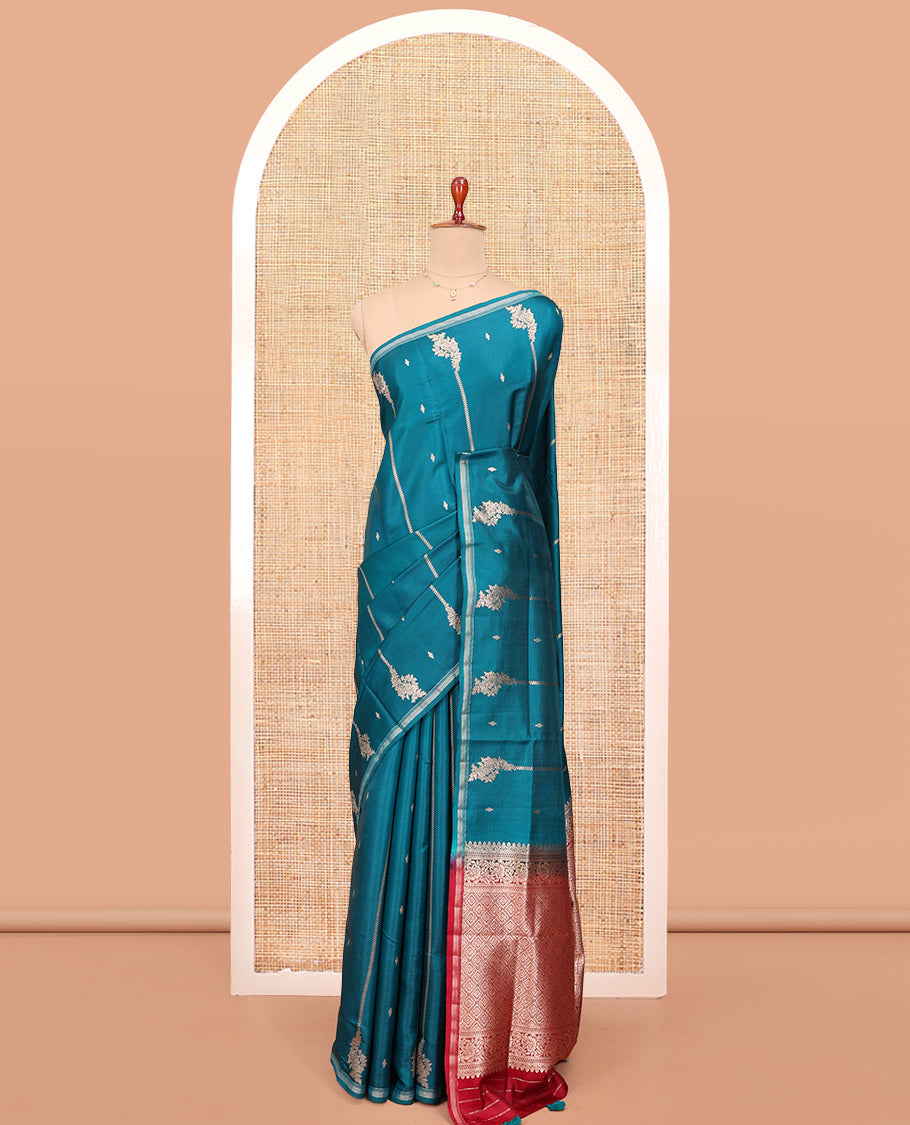 Peacock Blue Satin Silk Saree, Steeped in Richness of Floral Design All Over Its Body, a Subtle Zari Piping Border, Complemented by a Contrast Jaal Design Pallu, and Paired with a Contrast Blouse