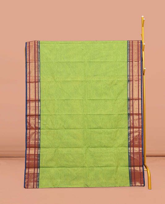 Leaf Green Plain Chettinad Cotton Saree, Complemented by Contrast Traditional Zari Design Border, Pallu of Stripes, and Paired with a Matching Blouse