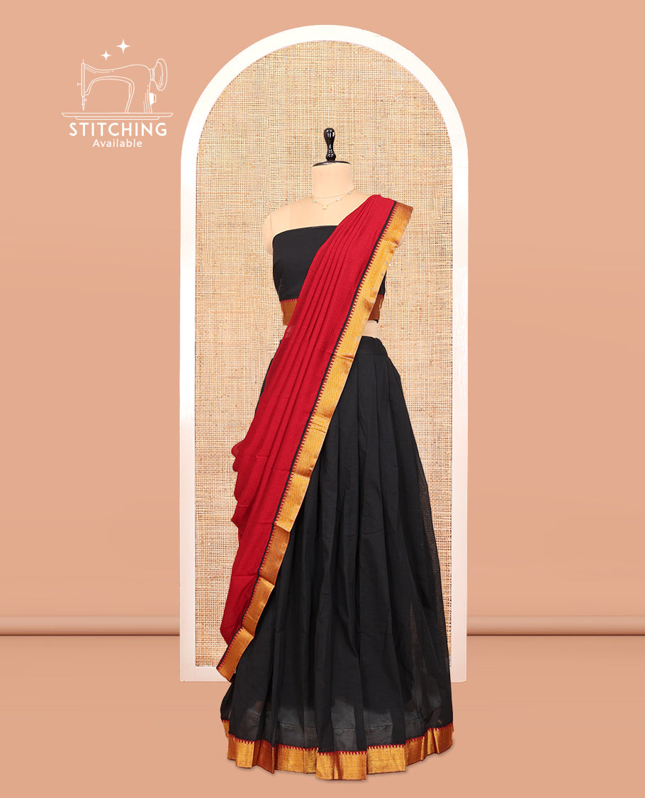 Black Cotton Half-Saree Features Plain Skirt, a Contrast Temple Zari Border, a Matching Blouse, and a Contrast Dhavani