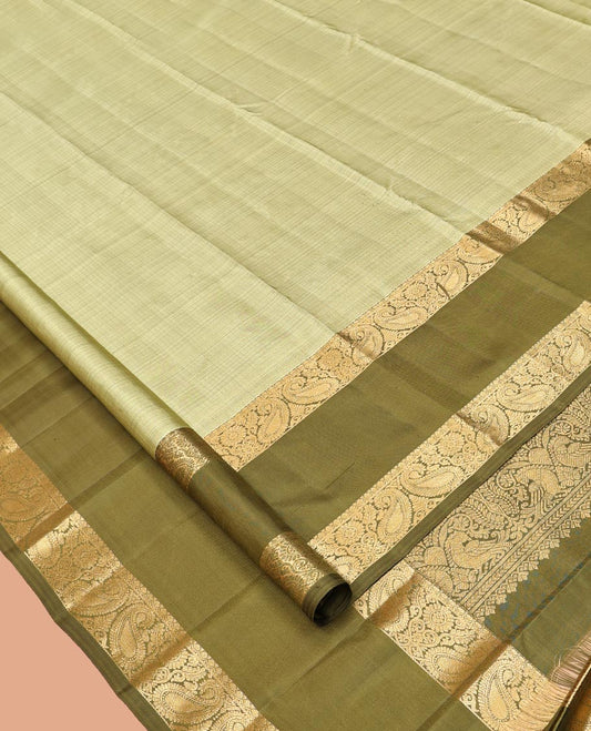Green Kanchipuram Silk Saree, Sparsely Woven with Checks, Complemented by a Contrast Rettai Pettu Manga Border, Grand Jaal Pallu, and Contrast Blouse