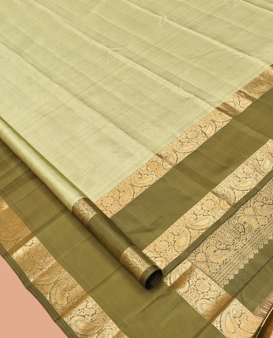 Green Kanchipuram Silk Saree, Sparsely Woven with Checks, Complemented by a Contrast Rettai Pettu Manga Border, Grand Jaal Pallu, and Contrast Blouse