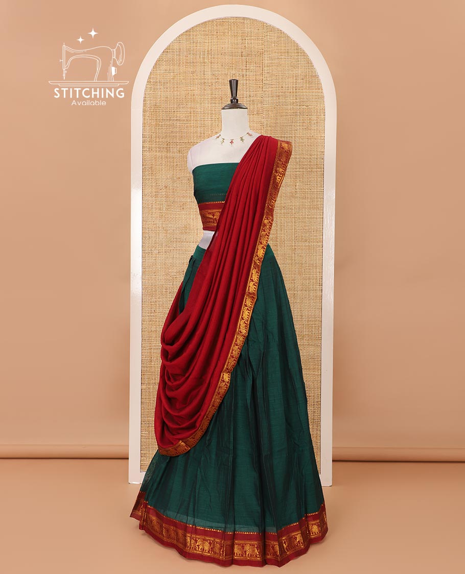 Green mercedised cotton half-saree, plain contrast elephant zari border skirt, matching blouse & contrast maroon zari elephant border dhavani