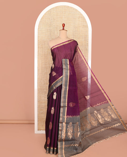 Purple Silk Cotton Saree, Accentuated with Zari Buttas All Over Its Body, Complemented by a Contrast Zari Striped Border, Pallu Features Floral Designs, and Paired with a Contrast Blouse