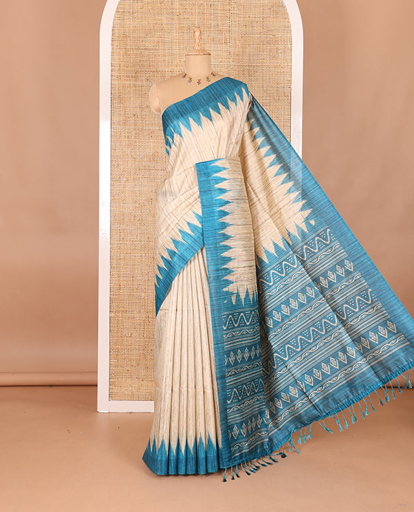 Chikku-rama green plain Khicha katan silk saree, contrast rama green temple border, ikkat printed pallu with tassels, and a contrast blouse