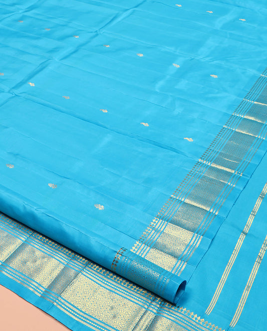 Blue Kanchipuram Silk Saree, Ornamented with Zari Buttas, Highlighted by a Zari One-Sided Border of Panner Sombu, Banaras, Muthu, and Jaal Designs, Grand Pallu, and No Blouse
