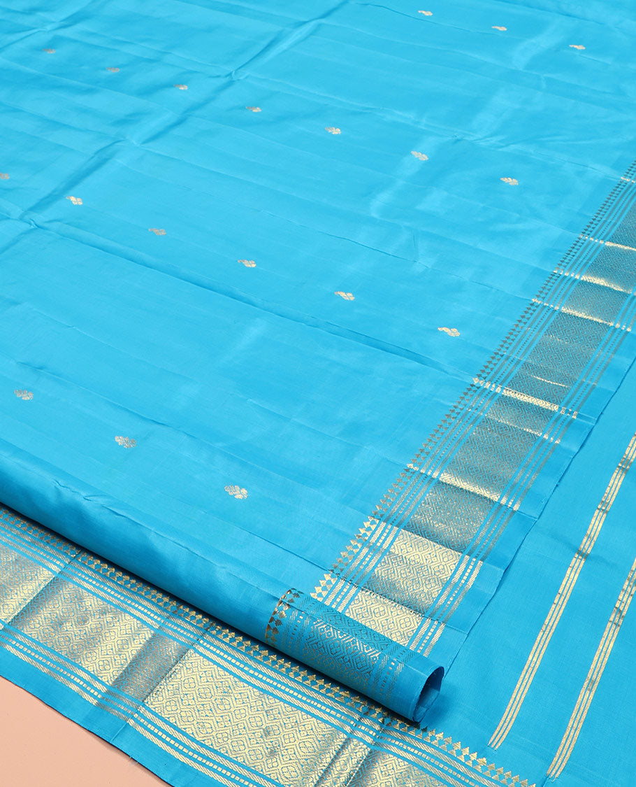 Blue Kanchipuram Silk Saree, Ornamented with Zari Buttas, Highlighted by a Zari One-Sided Border of Panner Sombu, Banaras, Muthu, and Jaal Designs, Grand Pallu, and No Blouse
