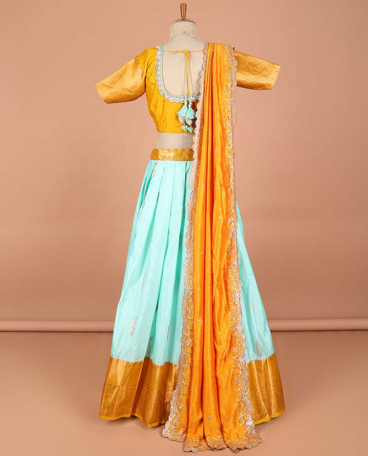 Blue paisley buttas semi-stitched half saree with contrast zari border,  embroidered blouse & scallop border dhavani