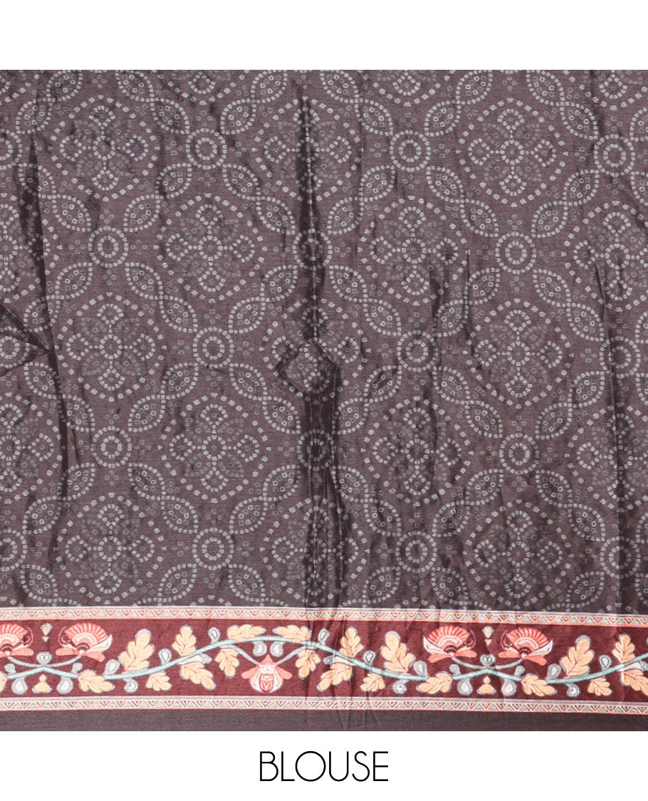 Black bandhani printed and mirror work masakali saree, floral creeper printed border, pallu of floral-peacock print, and a matching blouse