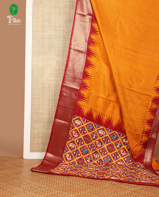Mustard striped negeative print dola silk saree with contrast temple zari design border & ikkat print pallu along with ikkat printed blouse