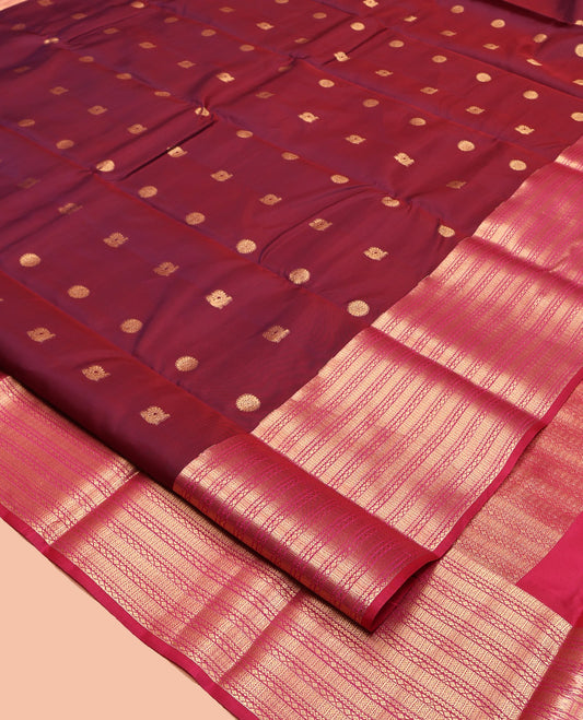 Maroon Vasundhara Lite Silk Mix Saree Features Mayil-Chakram Buttas, Complemented by a Contrast Border of Neli and Diamond, a Geometric Pallu, and a Contrast Blouse