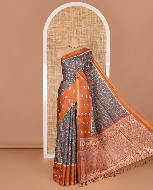 Grey and orange Pochampally ikkat printed katan silk saree, contrast deer motifs printed zari border, jaal printed pallu, and contrast deer motifs printed blouse