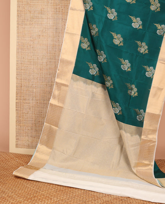Green floral buttas vasundhara elite silk saree with contrast zari design border & intricate zari design pallu
