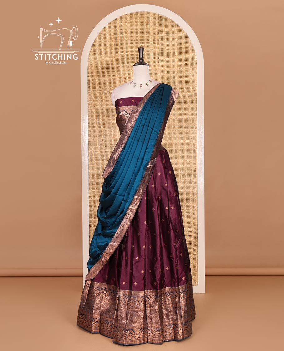 Wine taffeta silk half saree, zari buttas with contrast blue traditional zari border skirt, matching zari design blouse, and contrast plain zari border syska georgette dhavani