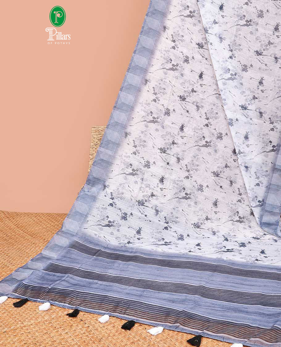 White color with navy blue leaf printed semi-chanderi cotton saree with lining chit pallu along with printed blouse
