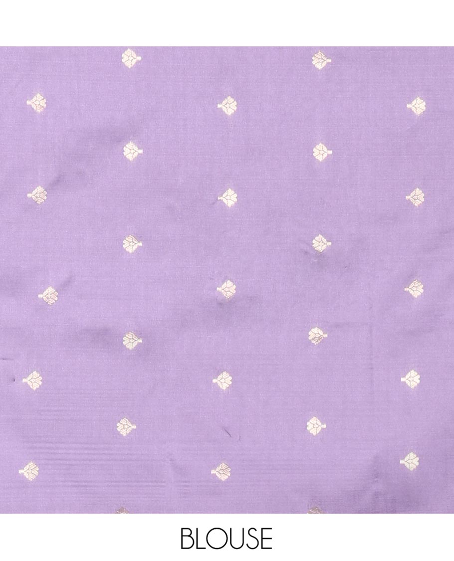 Lavender Plain Semi-Soft Silk Saree, Decked Up with Traditional Zari Designs Woven Border, Grandly Woven Pallu Steeped with Chakram Designs, and Paired with a Matching Blouse