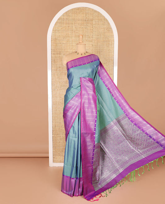 Blue small zari buttas woven elite soft silk saree, contrast zari woven scallop satin border, jaal pallu, and a contrast chakram zari motifs blouse