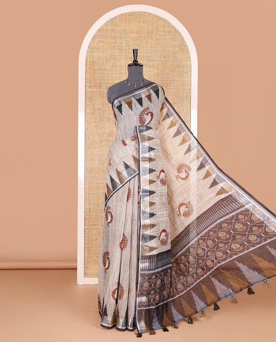 Chikku peacock motifs printed linen cotton saree, zari temple border, floral butta enclosed jaal printed pallu, and contrast buttas blouse