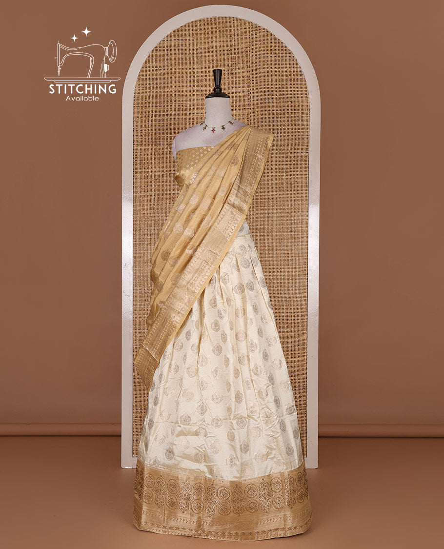 Cream and gold  semi-banarasi half-saree, zari buttas with contrast swarovski stone work border skirt, contrast zari buttas blouse, and intricate zari dhavani