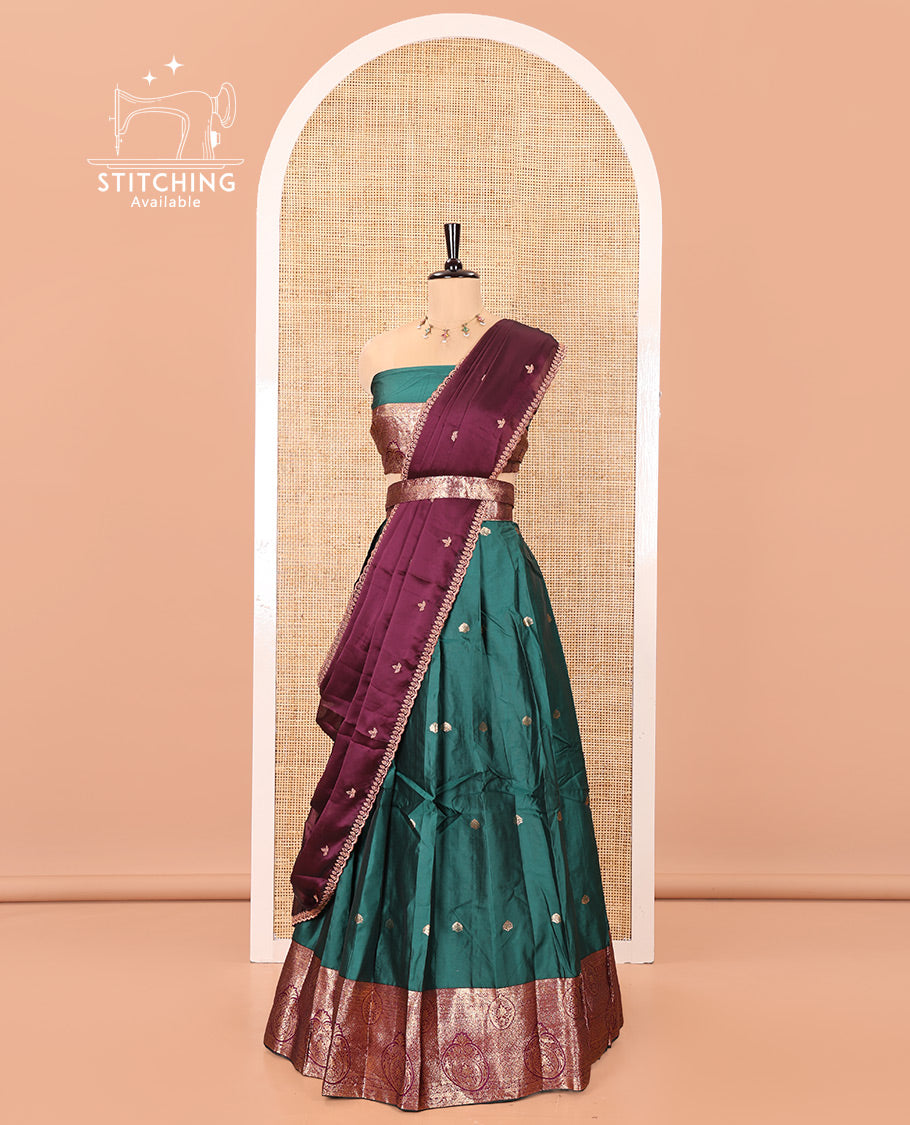 Green and Red Semi-Banarasi Half-Saree, Enriched with Zari Buttas on Its Skirt, Complemented by a Contrast Intricately Zari-Designed Border, Paired with a Matching Blouse, and a Contrast Satin Georgette Embroidered Scallop Dhavani