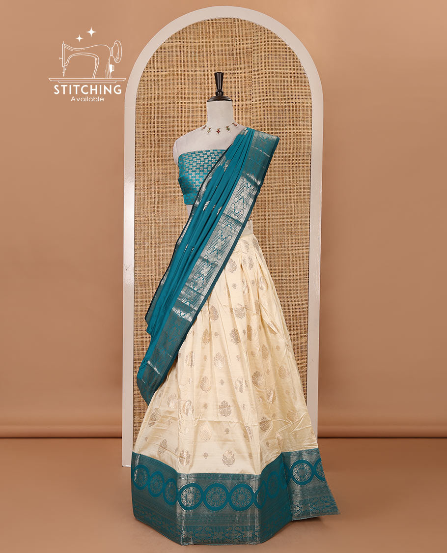 Cream-rama blue semi-banaras half-saree, zari buttas & contrast traditional zari border skirt, jacquard blouse & intricately zari woven dhavani