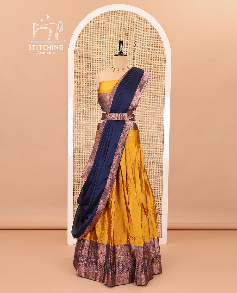 Mustard-blue taffeta half-saree, zari buttas with contrast traditional zari bordered skirt, a matching blouse, and contrast zari border dhavani with belt