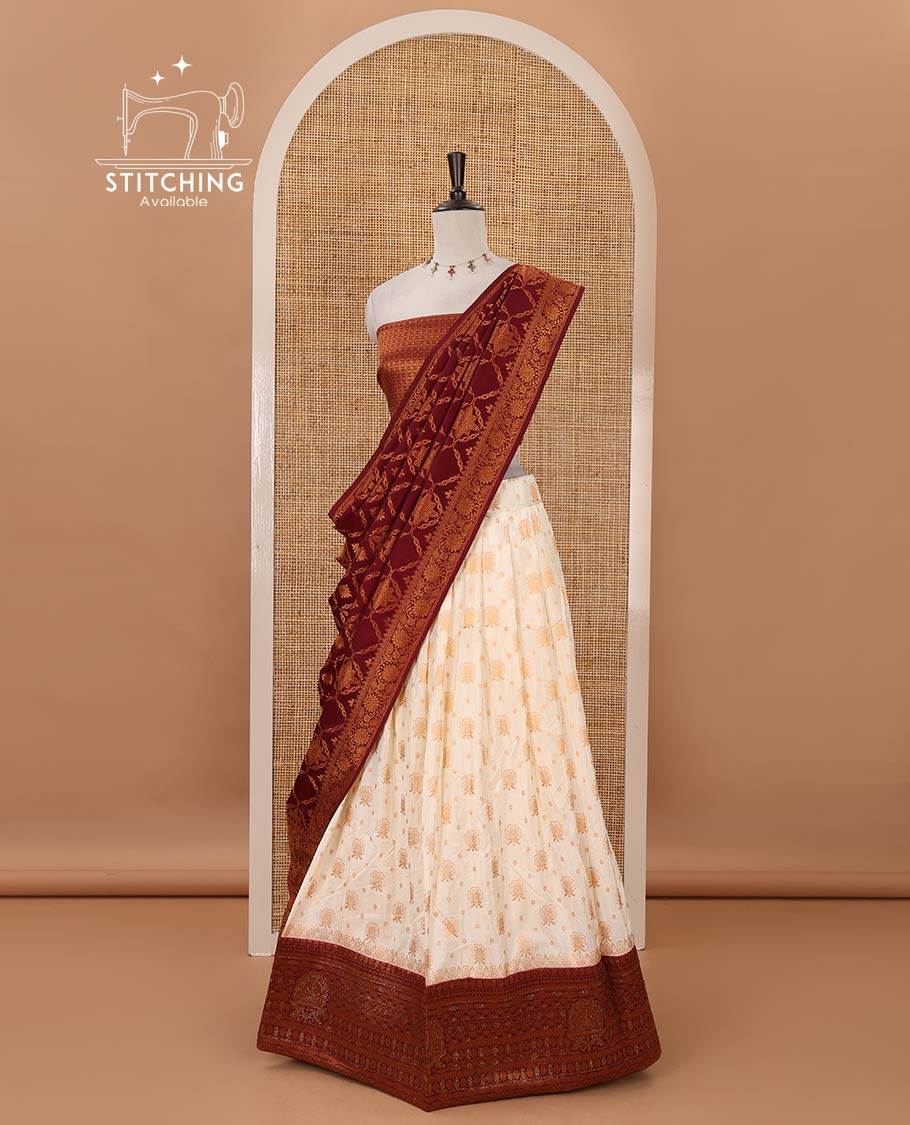 Cream semi-banaras half-saree, zari buttas & contrast Swarovski stonework traditional border skirt, jacquard blouse & contrast jaal jacquard maroon dhavani